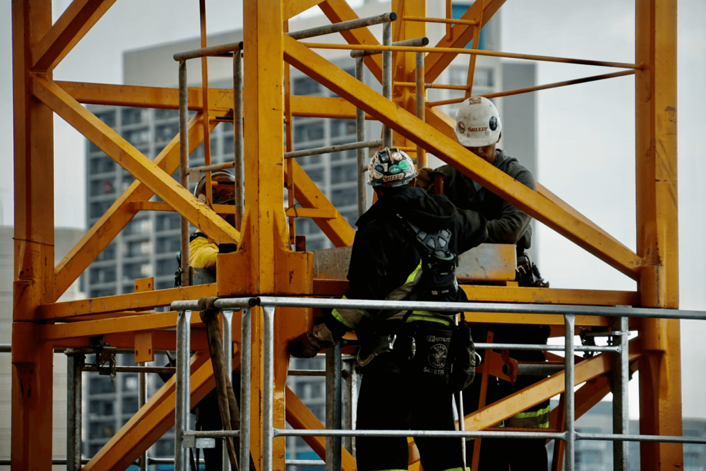 Maintenance technicians working on a crane