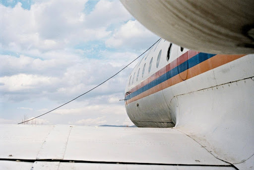 Emergency Slide Repair Services: Where to Find Them in Your Region 2 An exterior view of a docked plane. Source: Photo by Yuri Krupenin on Unsplash